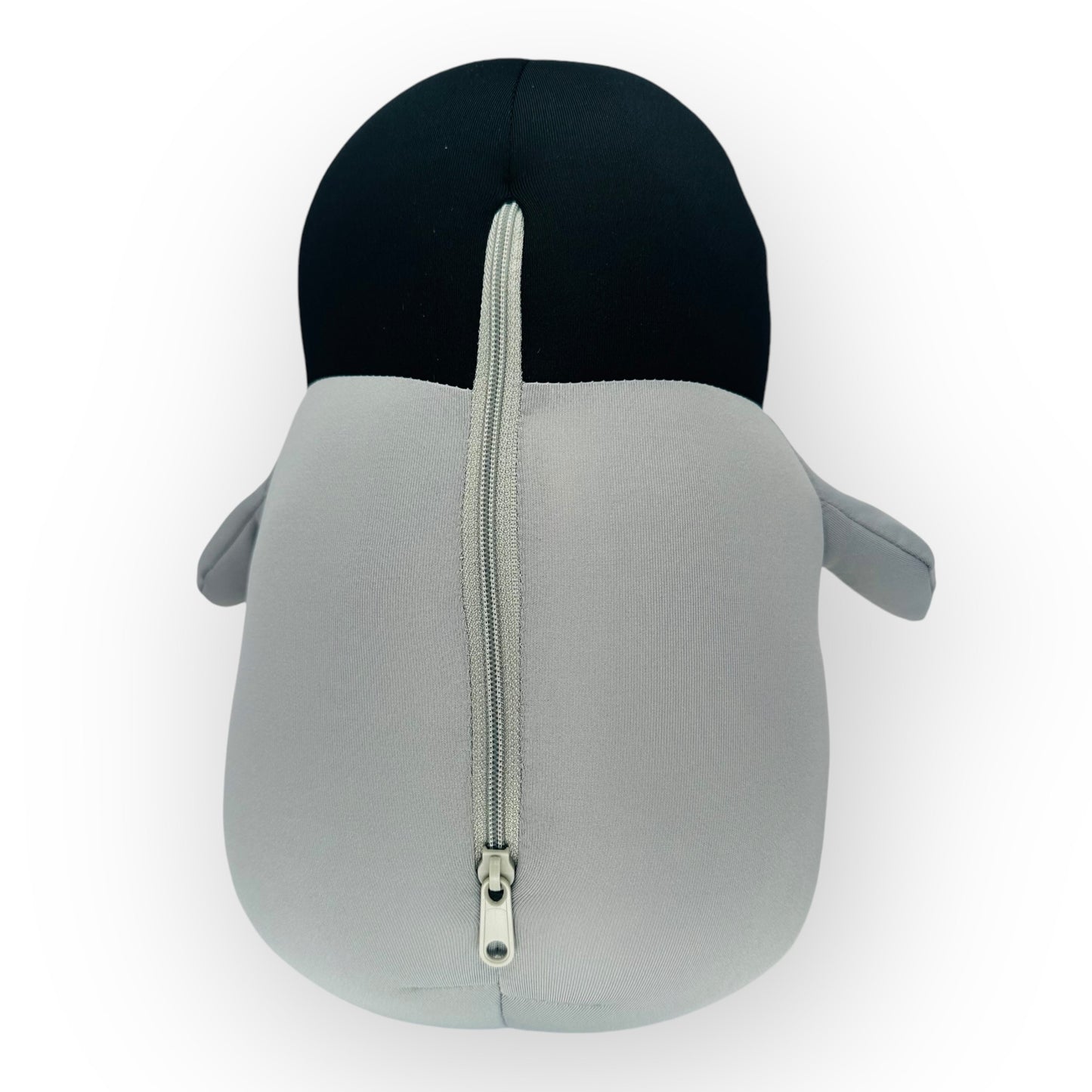 Back view of the JB Travel World plush penguin travel pillow showing the zip used to pull out the neck pillow.