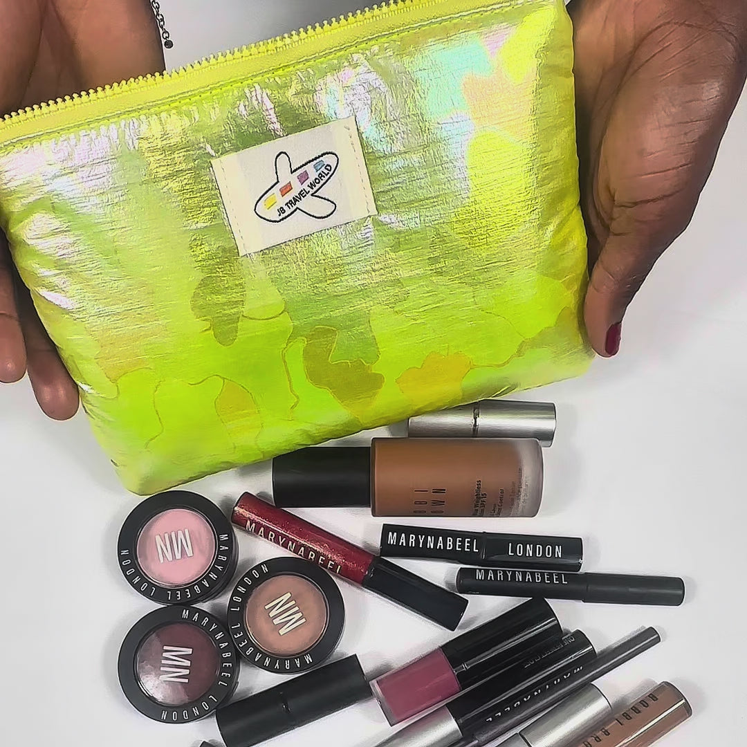 Demonstration video of the pink shimmer bag being filled with makeup and brushes, showing soft lining and compact design.