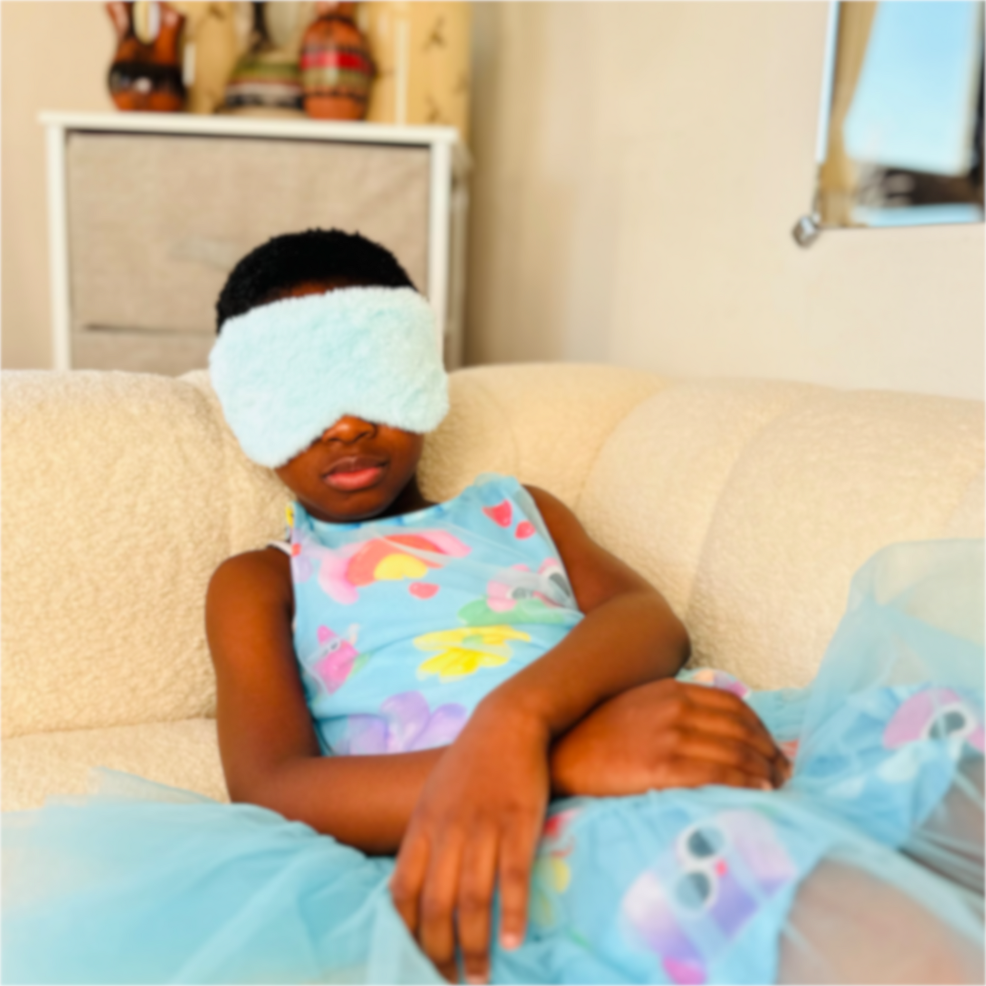 Soft and fluffy eye mask for comfort during travel or sleep, perfect for blocking out light.