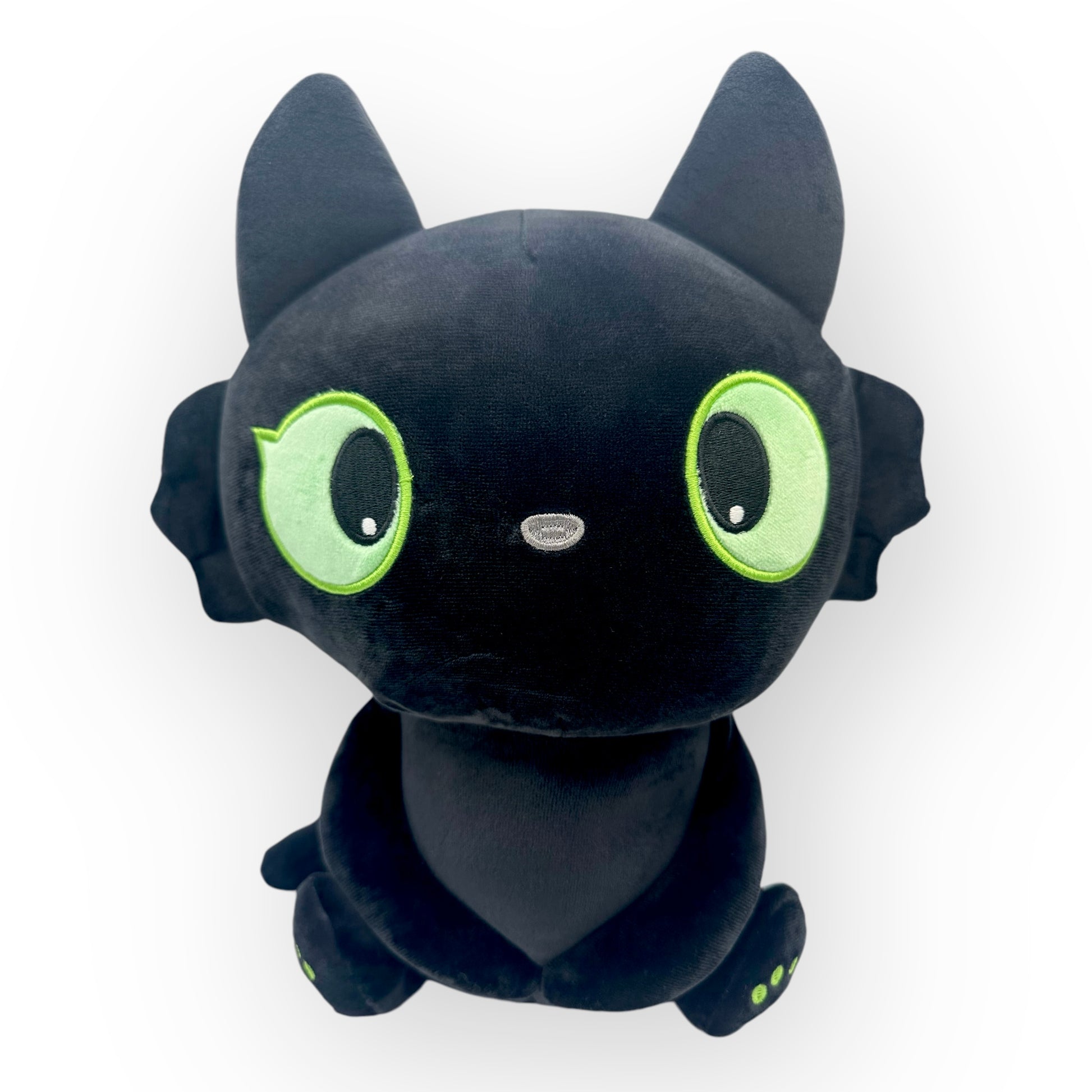 Adorable kids black cat travel pillow that transforms from a cuddly black cat plush into a cozy U-shaped pillow for comfortable travels.